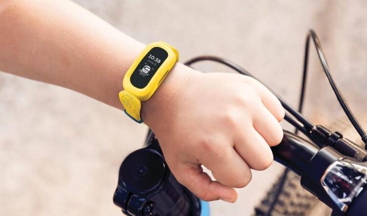 Lifestyle photo of Fitbit Ace 3 Minions band.